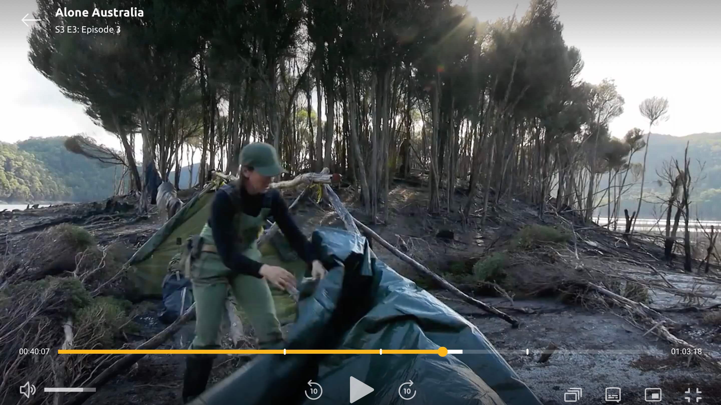Karla building her shelter under a distinctive tree island
